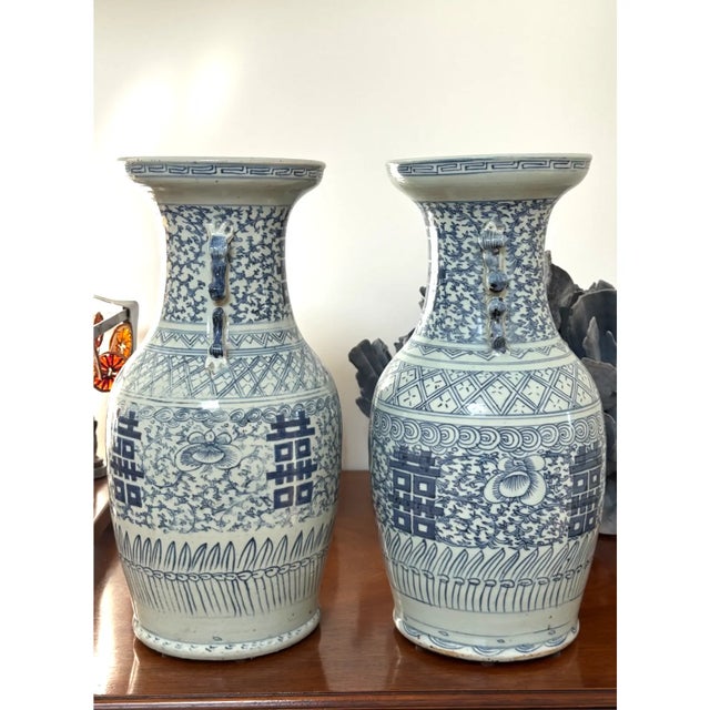 This is a beautiful pair of antique Mid-Quing Dynasty Chinese Double Happiness vases, they are in excellent condition with...