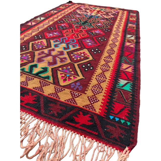 Elevate your living space with this magnificent, museum-quality vintage flatweave kilim, handcrafted in the renowned Avşar...