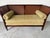 Elegant Hollywood Regency style settee from Baker Furniture’s “Milling Road” collection, featuring a beautifully sculpted...