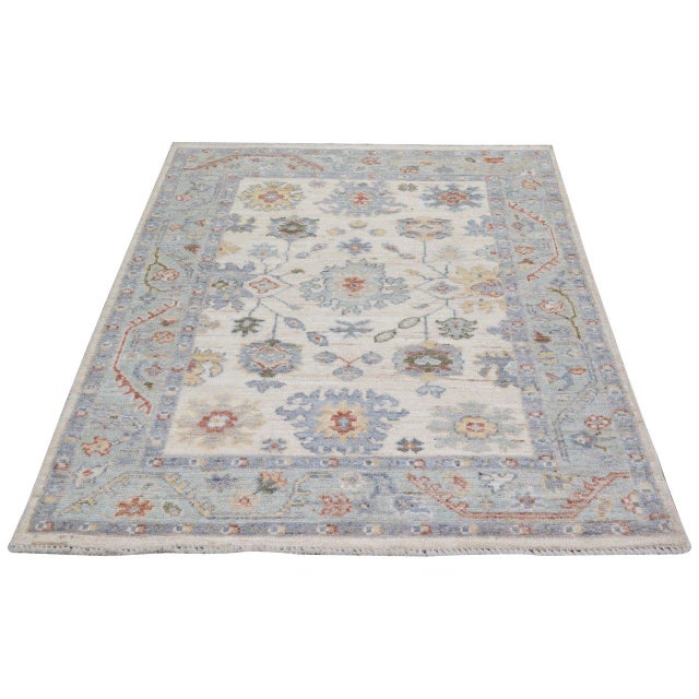 Hand-knotted with care using traditional rug-making techniques, this wool rug blends timeless craftsmanship with a modern...