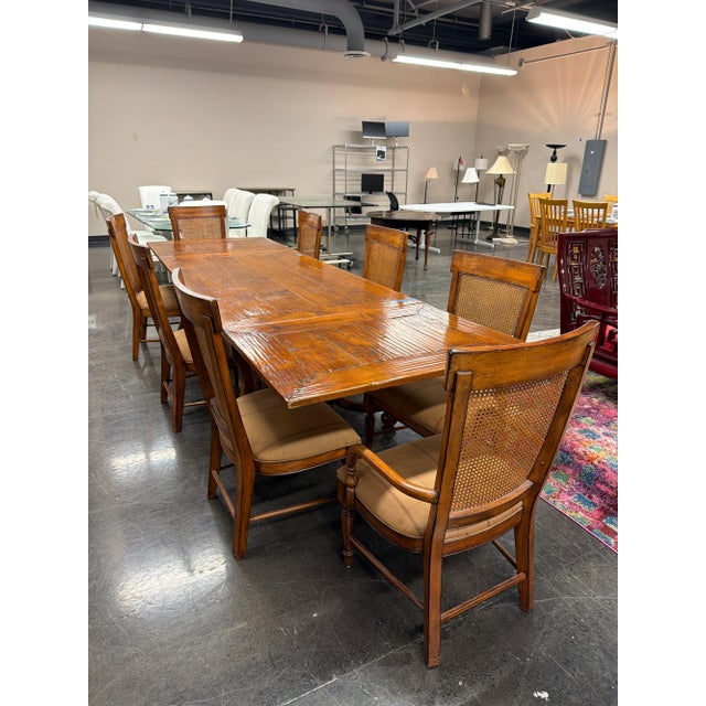 Acquisitions by Henredon nine-piece dining set: a substantial trestle-base extension dining table with two armchairs and...