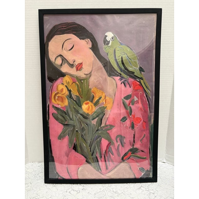 Lush vibrant colorful framed print of a woman resting amidst flowers with a whimsical parrot on her shoulder. Pinks and...