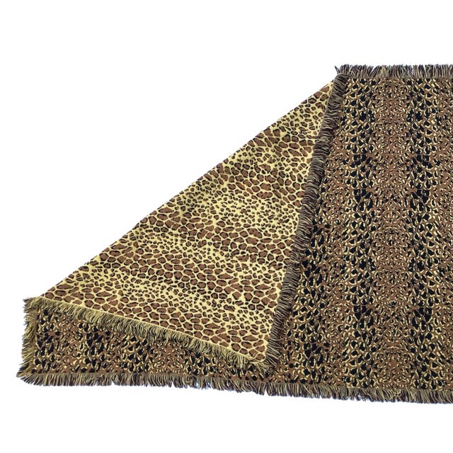 Animal print woven throw with fringe. Reversible and in wonderful vintage condition. Use as is or make a couple of pillows.