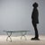 Coffee table in lacquered metal, beveled glass top. This piece is attributed to the mentioned designer/maker. It has no...