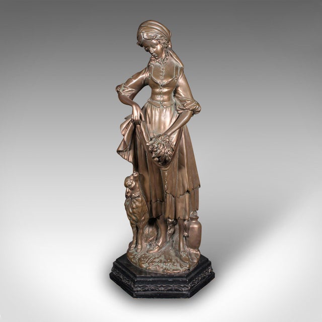 This is a tall antique female figure. An Austrian, bronzed plaster statue, dating to the late Victorian period, circa...