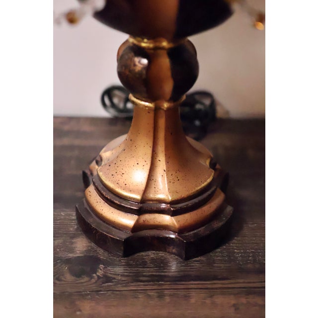 A striking and stately Hollywood Regency revival 4-arm candelabra table lamp, standing an impressive 31 inches tall. This...