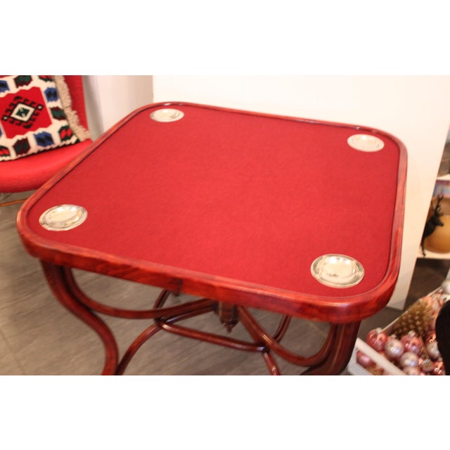 - Made of beechwood - Mahogany colored - Square top with rounded corners - Wine red felt cover - 4 pickled brass bowls for...