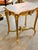 A highly decorative French Rococostyle side table featuring a richly painted top, sculptural gilt detailing, and an...