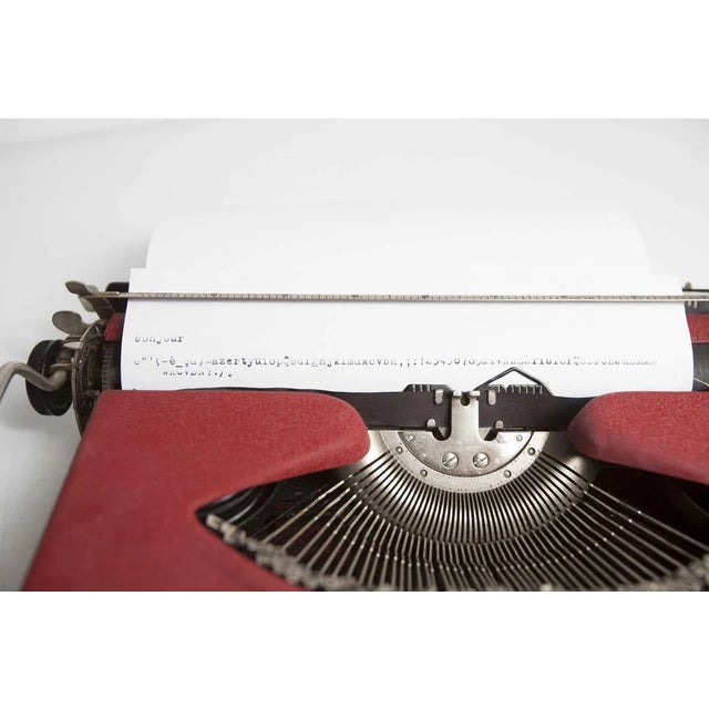 The typewriter brand gossen tippa model a mkii burgundy color see red. It is a machine of the 50s (produced between 1951...