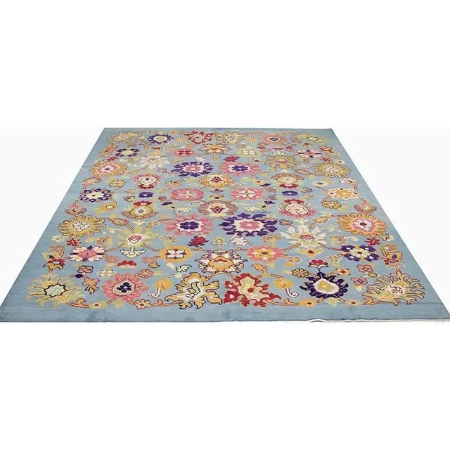 ACTUAL SIZE: 8’8″ x 11’4″ PRIMARY COLOR: Blue / Multi AGE: New MATERIALS: Wool FOUNDATION: Cotton PRODUCTION: Handwoven,...