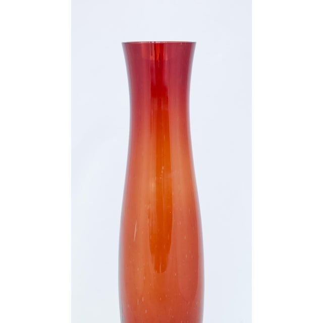 Large vase made of hand-blown soda glass, in-mass colored, with a multicolored gradient transition between red and orange,...