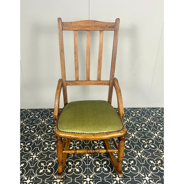 This stunning, graceful, and comfortable mid-18th-century Victorian rocking chair is made of solid oak and comes with the...
