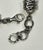 This beautiful bracelet is made up of eleven chains of varying link styles and a slider charm that matches the end caps....