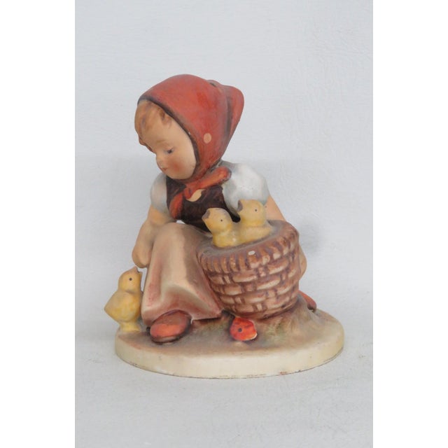 This adorable Girl with 3 Chicks Figurine is made of ceramic earthenware. This charming figurine titled "Chick Girl" is a...