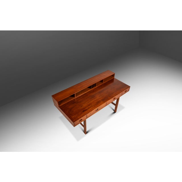 This sophisticated Danish Mid-Century Modern flip-top executive desk by Peter Løvig Nielsen, crafted in Denmark during the...