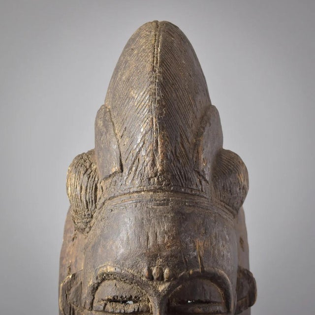 The Baule people, residing in CÃ´te d'Ivoire, West Africa, are renowned for their masterful artistry in crafting portrait-...
