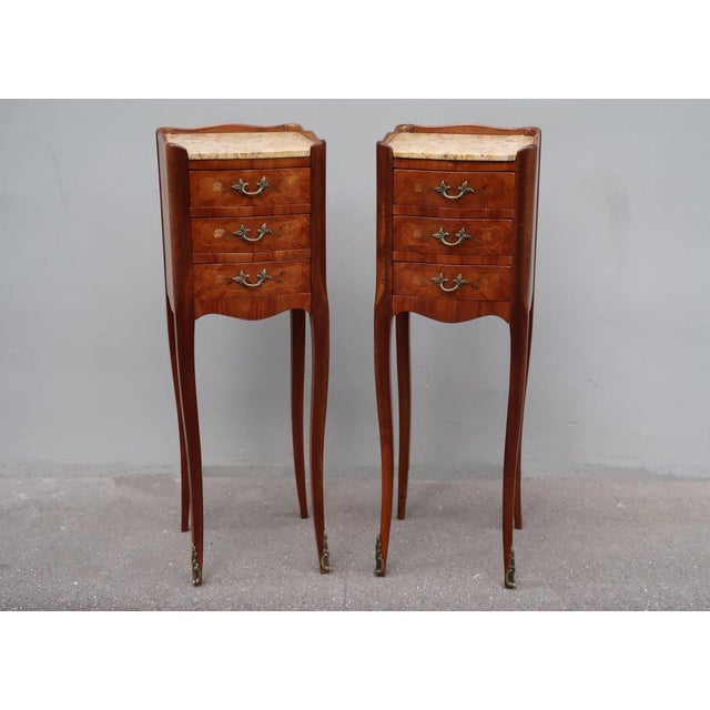 Very rare and elegant set of two narrow rosewood french Louis XV style side tables nightstands. Parisian work from the...