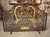 More information coming soon… This highly scrolled wrought iron firescreen from the 1950s is adorned with gilt highlights,...