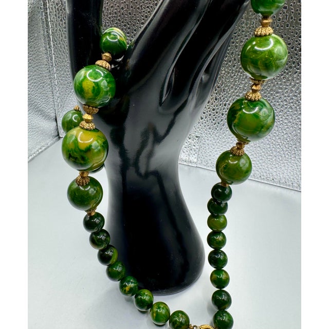 1950s Bakelite Pendant Necklace With Green and Yellow Marbled Beads and a Gold Tone Monkey Pendent Holding Beads Excellent Pre Owned Condition For Sale - Image 10 of 12