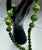 1950s Bakelite Pendant Necklace With Green and Yellow Marbled Beads and a Gold Tone Monkey Pendent Holding Beads Excellent Pre Owned Condition For Sale - Image 10 of 12