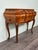 Venetian Baroque console table. Curved walnut cabinet with six small drawers. Saber-shaped legs with carved decorations....