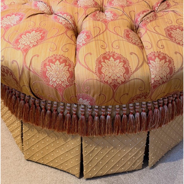 A beautiful custom upholstered silk ottoman on casters. Gorgeous colors! Top notch fabric. Tufted top with beautiful...