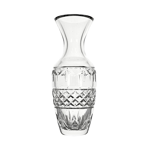 A Waterford Crystal bud vase in the Ballina pattern, produced in Ireland and dating to circa 2000 through the early...
