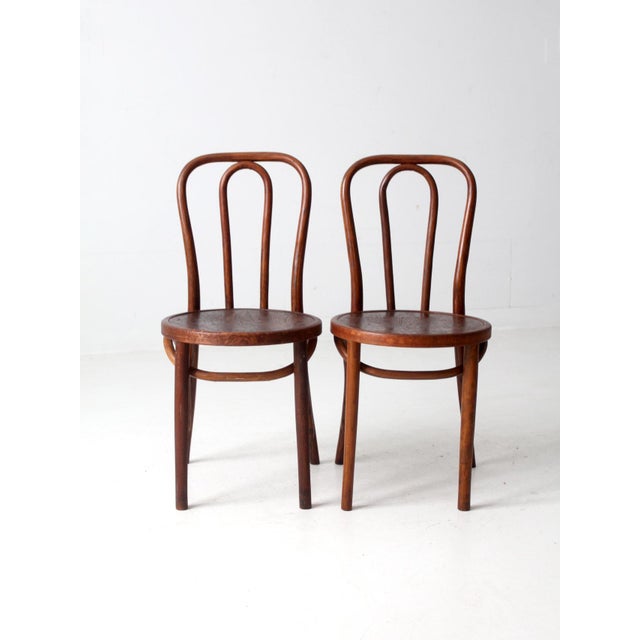 This is a pair of Great Northern Chair Company bentwood chairs circa 1940s. The classic cafe chairs have clean curving...