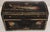 This antique wooden box features a hand-painted black surface decorated with stylized floral and foliate motifs in red,...