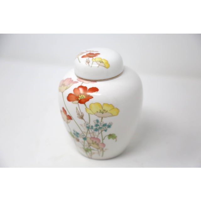 A vintage Japanese ginger jar, decorated with colorful poppy flowers. Good condition.