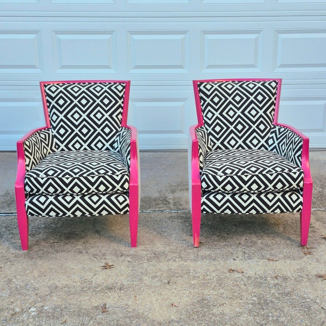 This is a striking pair of “Nadia” exposed wood bergere lounge chairs custom made by Sam Moore, a division of high-end...