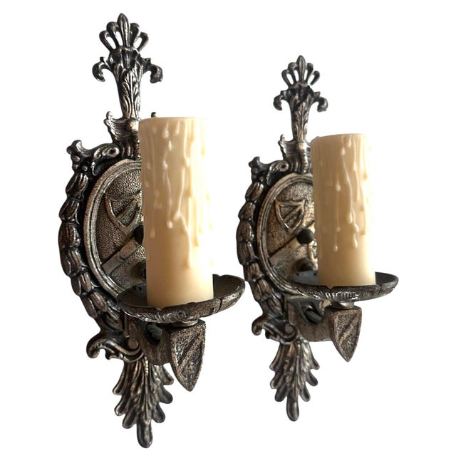 Crest and acanthus motif fabulous on these original silverplate sconces. Great fir any room in your home. 2 pr available