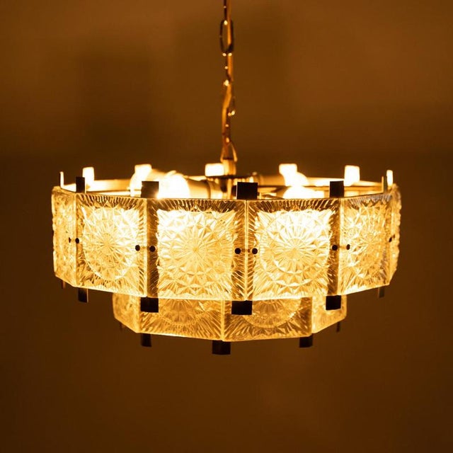 The opulent glass chandelier was designed in the 1970s by Jaroslav Bejvl for the Kamenický Šenov glassworks. The company...