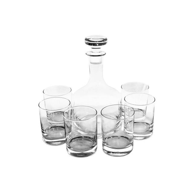 Vintage mouth blown hand crafted crystal decanter with glass stopper and six tumblers. Decanter, 44 ounce; 6” L x 6” W x...