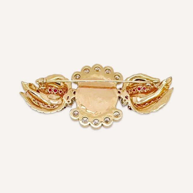 This is part of Chairish’s Fine Jewelry assortment. One rare color cat’s eye chrysoberyl, diamond and ruby brooch made of...