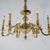 Large Antique Neoclassical Brass Chandelier with Six Scroll Form Arms and Faceted Font, c1930 Measures- 32''H x 32.5''W x...