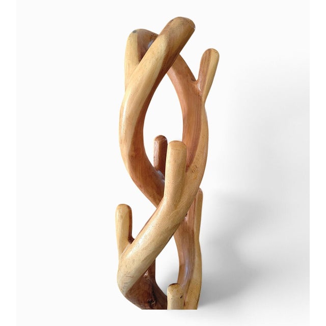 Stunning suar wood sculpture, perfect for use as a coat rack, hat stand, or scarf holder. It will look beautiful in a...