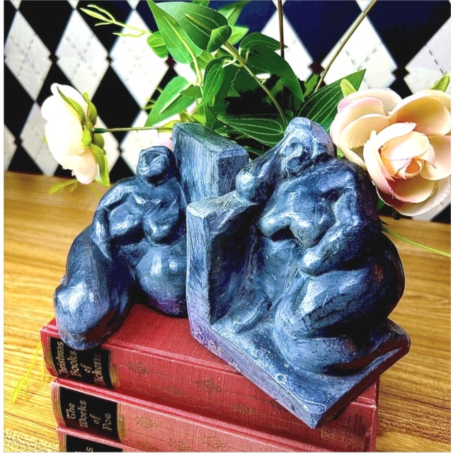 Pair of signed figurative bookends by Uruguayan artist and architect Eduardo Strauch, dated 1994. Each sculptural bookend...