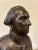 A plaster bust of George Washington with a bronze finish applied to give it a more regal appearance. George has...