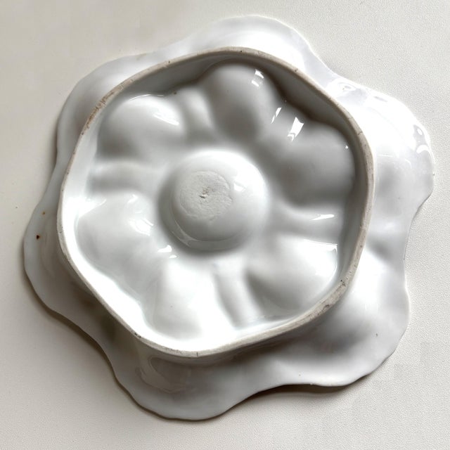 Add drama and elegance to your collection with this striking antique oyster plate, crafted circa 1880–1910. The design...