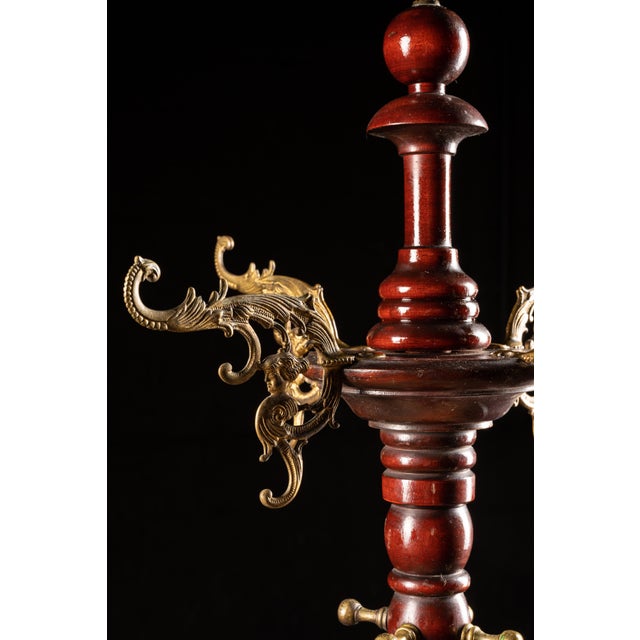 This antique mahogany coat rack is in its original finish. This coat rack features barley twisted wood and brass...