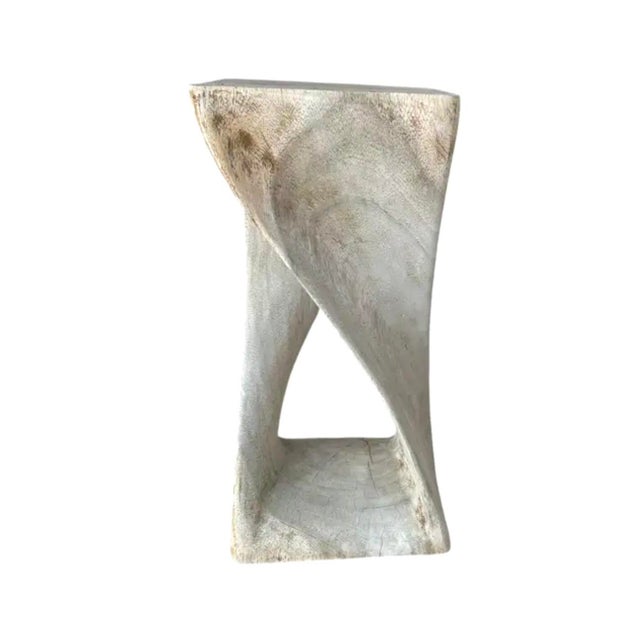 Hand-Carved Bleached Mahogany Pedestal Side Table. Pedestal showcases a sculptural twisted form that transforms a...