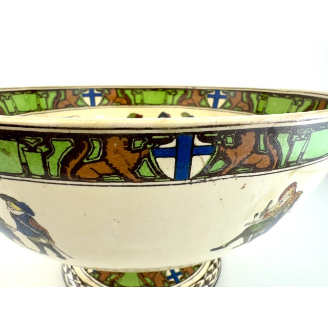 A striking Royal Doulton seriesware bowl from the coveted Musketeers collection, dating to the early 20th century. This...