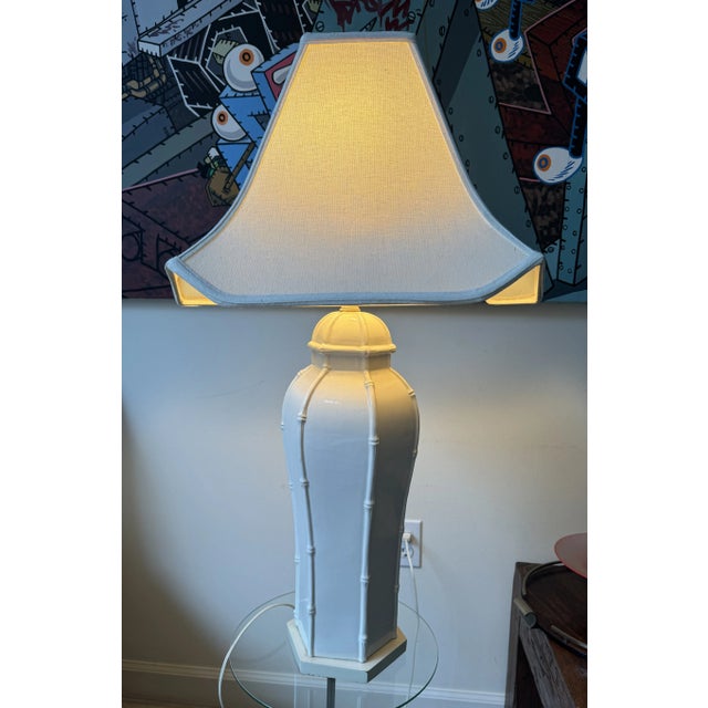FRom a Palm Beach Estate, Pair of Vintage Ceramic Lamps with faux Bamboo pattern on six sides. Each with white shades with...