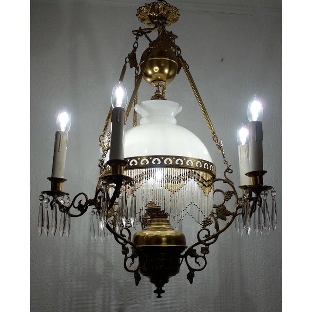 Antique French Brass Glass Bead Seven-Light Chandelier, 1920s, in Very Good conditions. Designed 1890 to 1919 I have...