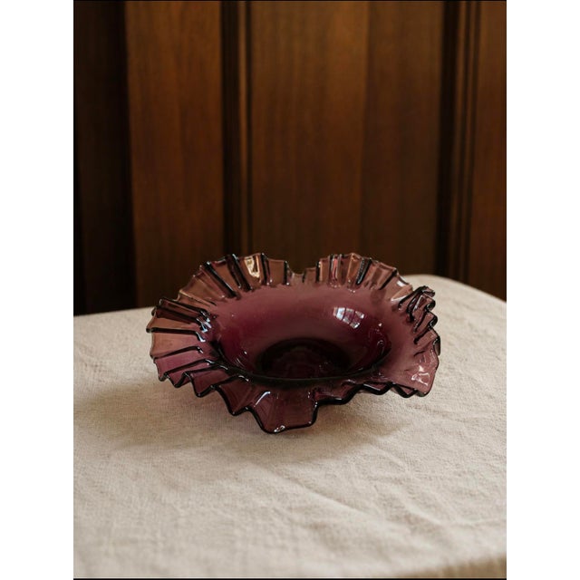 A stunning vintage amethyst plum art glass ruffled bowl in the style most associated with the beloved Fenton Art Glass...