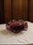 A stunning vintage amethyst plum art glass ruffled bowl in the style most associated with the beloved Fenton Art Glass...