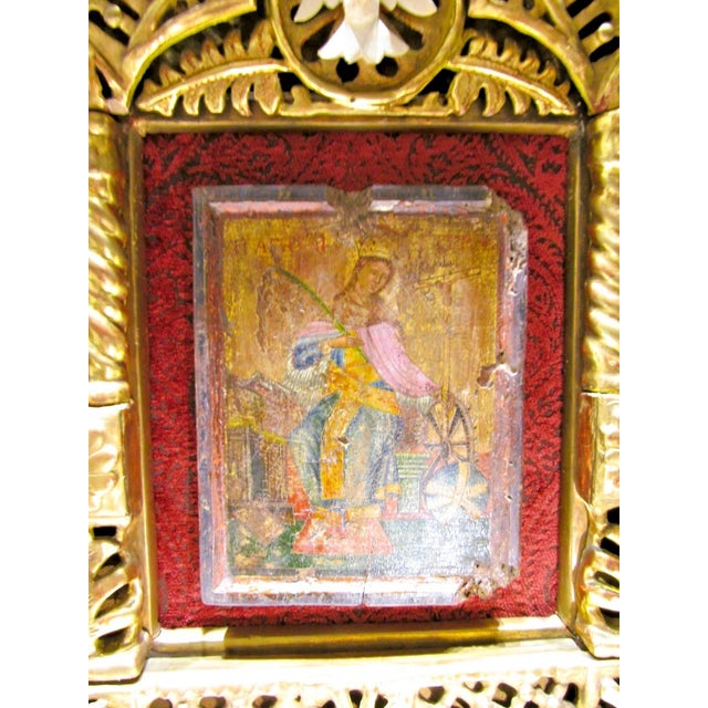 This is a rare antique icon of St. Catherine of Alexandria. This collectible item is a unique piece of Christian art that...