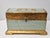 This charming Italian trinket box is turquoise with gilt highlights and base. The interior of the box is 6.5 inches in...