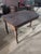 Timeless vintage mahogany tripod pedestal table featuring a gracefully shaped rectangular top with rounded corners, a...